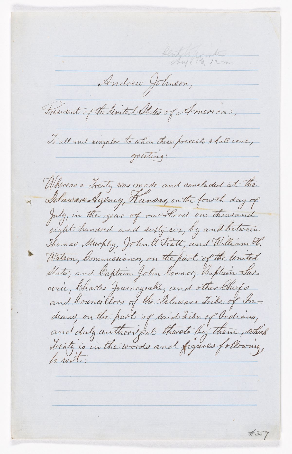 Cursive writing is atop a blue lined paper.
